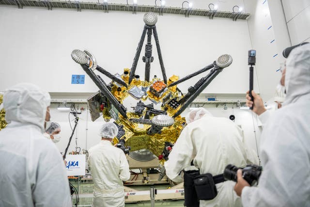 Members of the media film Exploration and Return Modules, making up the Martian Moons eXploration (MMX) spacecraft, at the Tanegashima Space Center in Minamitane, Kagoshima prefecture on August 13, 2026