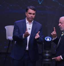 Lula e Flávio Bolsonaro durante debate Band/Estadão Foto: Werther Santana/Estadão / Estadão