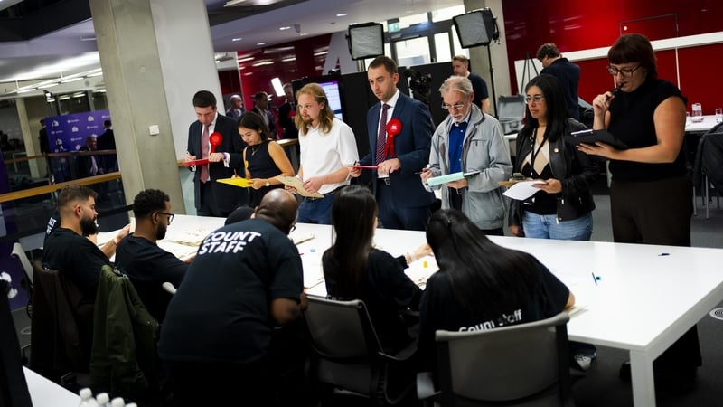 Ballot papers are counted by staff.