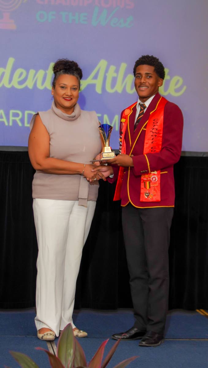 Ricardo Davis, a first-year law student at The University of the West Indies and past student of Cornwall College, receives the VIP Attractions Distinguished Student-Athlete Triathlon Award from Tanya Beckford, chief executive officer of VIP Attractions Li